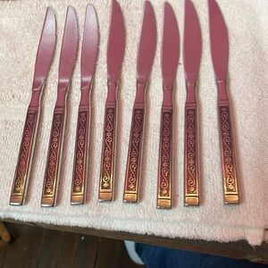 Retro vine scroll pattern stainless steel knives. Set of 8